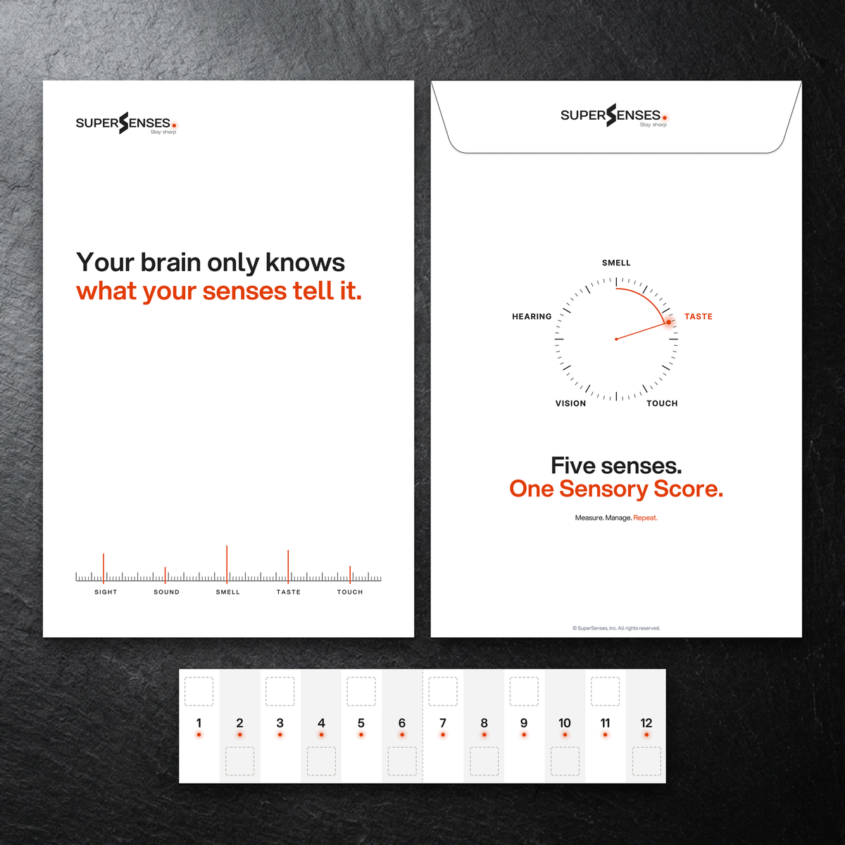 SuperSenses Five Senses Kit envelope front and back with numbered test cards on a slate background